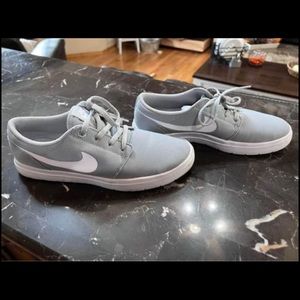 Gray white Portmore sneakers.  Youth Nike size 6Y